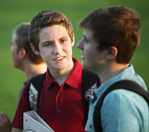 two teenage boys talking